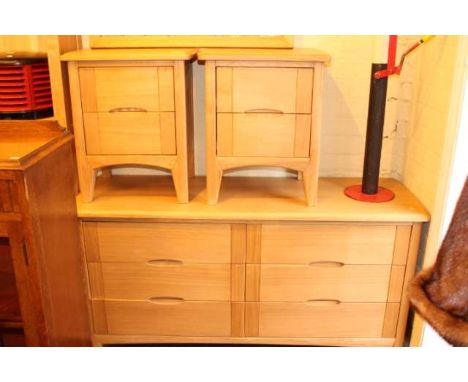 Four piece suite of light oak furniture comprising open bookcase, six drawer chest and pair two drawer pedestal chests