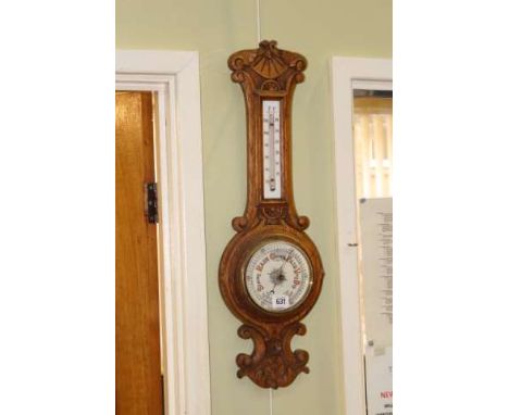 Carved oak aneroid barometer