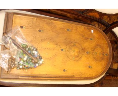 Vintage wooden bagatelle with marbles and steel balls