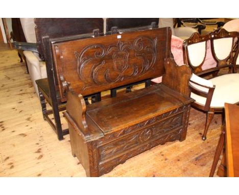 Carved oak monks bench