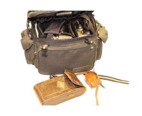 Collection of camera equipment and two books
