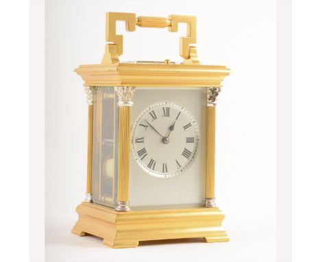 A French gilt metal corniche-cased hour-repeating carriage clock, silvered face, platform escapement, signed E. M. &amp; Co.,