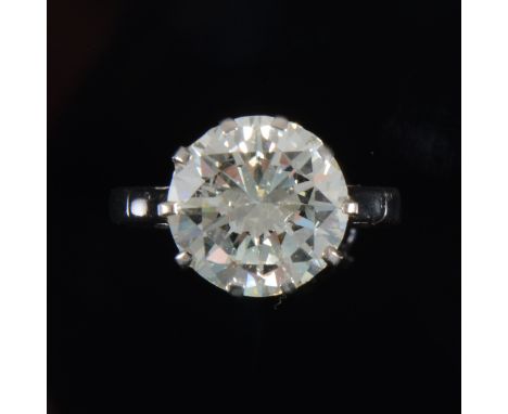 A diamond solitaire ring, the brilliant cut diamond claw set in an all white metal single stone mount, mark obscured testing 