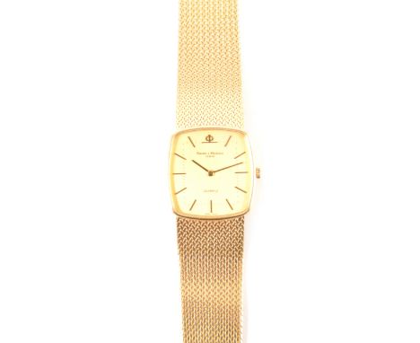 Baume &amp; Mercier - a gentleman's quartz 18 carat yellow gold bracelet watch, the rectangular cushion shaped champagne bato