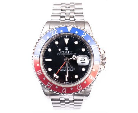 Rolex - a gentleman's GMT Oyster Perpetual Date GMT Master wrist watch with "Pepsi" bezel, 30mm black dial with luminous dot 