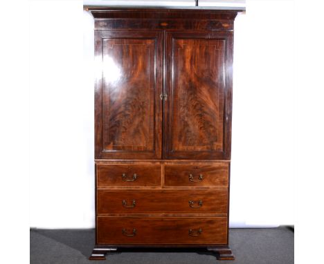 A George III mahogany linen press, plain moulded cornice, with shell inlay to the frieze, the upper section with two panelled