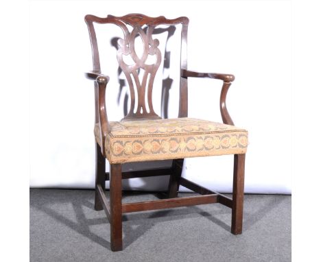 Chippendale Gothic style stained wood elbow chair, circa 1900, arched and moulded back with Gothics tracery, shaped arms, pat