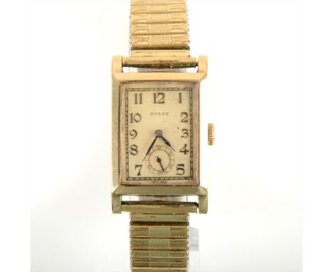Rolex - a gentleman's 9 carat yellow gold wrist watch, the rectangular cream arabic dial having a subsidiary seconds dial in 