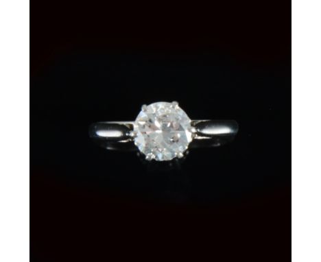 A diamond solitaire ring, the brilliant cut diamond claw set in an all white metal mount with spear point and tube shoulders,