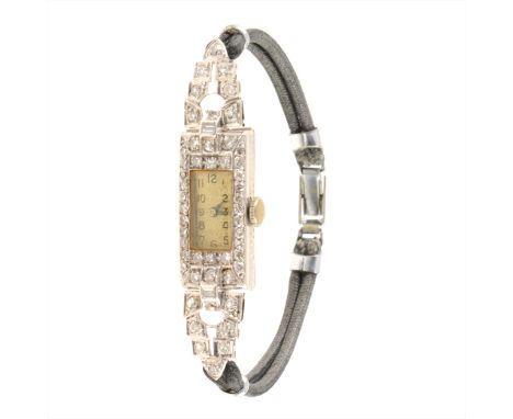 A lady's diamond cocktail watch, the rectangular arabic dial set in a white metal case numbered 3077, marked inside "All Plat