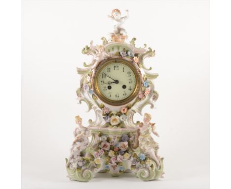 A Continental porcelain mantel clock, ivorine dial with Arabic numerals, French cylinder movement, striking on a bell, the ca