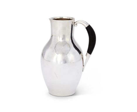 Y A DANISH SILVER COLOURED WATER JUG OR PITCHERPOST 1945 STAMPED MARKS, NO. 743, DESIGNED BY JOHAN ROHDEWith an ebony handle1