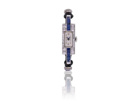AN ART DECO DIAMOND AND SAPPHIRE COCKTAIL WATCH CIRCA 1930The rectangular dial with Arabic numerals, within a rectangular bag