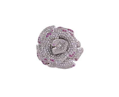 A DIAMOND AND RUBY ROSE DRESS RINGThe undulating petals pavé set with brilliant cut diamonds, with circular cut ruby accents,