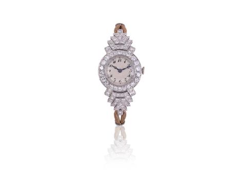 A 1920S DIAMOND COCKTAIL WATCHThe silvered circular dial with Arabic numerals, blued steel hands, within an old brilliant cut