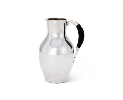 Y A DANISH SILVER COLOURED WATER JUG OR PITCHERPOST 1945 STAMPED MARKS, NO. 743, DESIGNED BY JOHAN ROHDEWith an ebony handle1