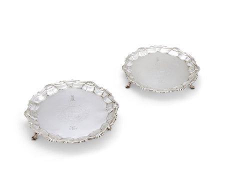 A PAIR OF GEORGE II SILVER SHAPED CIRCULAR WAITERSWILLIAM PEASTON, LONDON 1751With a scroll and shell border, engraved with a