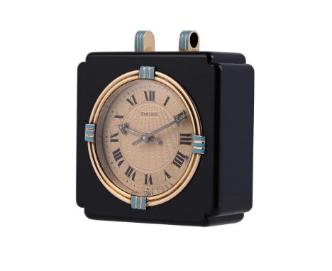 CARTIER, AN ONYX, GOLD AND ENAMEL TRAVEL DESK CLOCK, NO. 6326 CIRCA 1925The circular gilt dial with engine turned centre and 