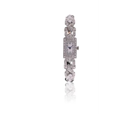 AN ART DECO DIAMOND COCKTAIL WATCH CIRCA 1930The tonneau shaped dial with Arabic numerals, within a rectangular eight cut dia