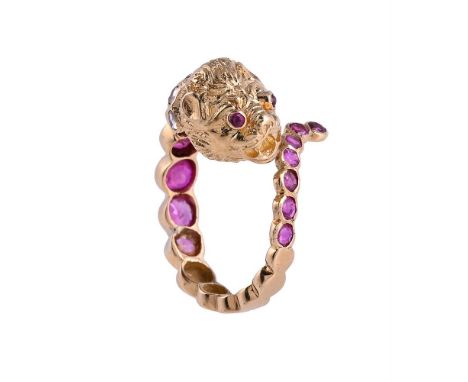 A RUBY AND DIAMOND LION RING The coiling ring set with graduated circular cut rubies, to a textured lions head with ruby eyes