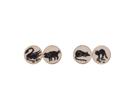 A PAIR OF MID 20TH CENTURY FRENCH GOLD COLOURED AND ENAMEL CUFFLINKSThe circular panels with stylised cross stitch black and 