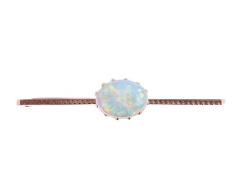 AN OPAL BAR BROOCHThe oval cabochon opal within a claw setting, to a textured bar Size/dimensions: opal 11mm x 7mmGross weigh