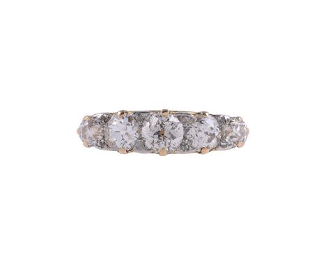 A FIVE STONE DIAMOND RINGThe graduated old brilliant cut diamonds with pairs of diamond points between, approximately 1.05 ca