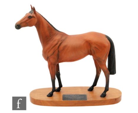 A Beswick Connoisseur model of Red Rum, mounted to a wooden plinth, height 32cm. 