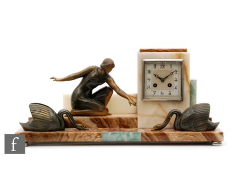 An Art Deco French coloured marble mantle clock mounted with a figure feeding two swans, eight day movement, width 42cm. 