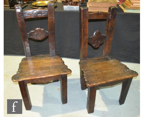 A pair of reproduction rustic oak ladder back chairs with naturalistic panelled seats over square block legs. (2) 