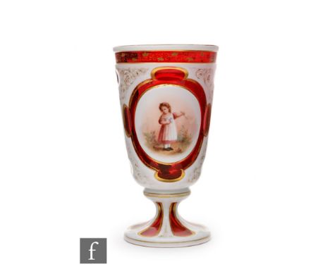 A 19th Century Bohemian goblet in the manner of Neuwelt or Moser, with splayed circular foot and flared body cased in opal ov