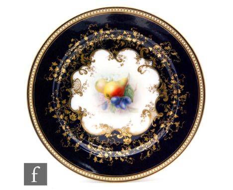 A Royal Worcester cabinet plate decorated by R. Sebright with pears and grapes between a blue and gilt border with foliate sc