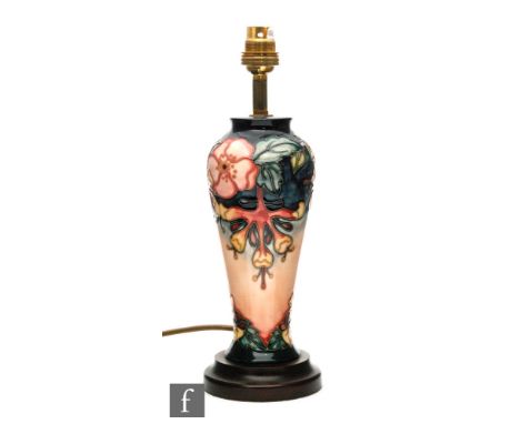 A modern Moorcroft Pottery table lamp in the Oberon pattern designed by Rachel Bishop, affixed to a wooden plinth, marks obsc