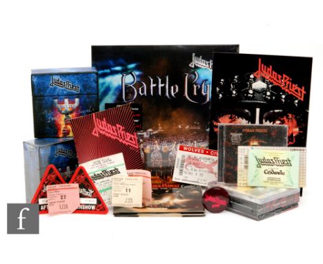 A collection of Judas Priest related memorabilia to include six 7" vinyl singles, two 'single cuts' CD singles collection box