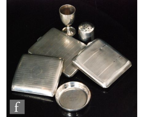 Three hallmarked silver cigarette cases each with engine turned decoration with a small dish, an egg cup and a bottle top, to