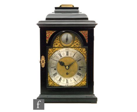 A 19th Century and later ebonised bracket clock with later associated dial and movement, the 18cm broken arch brass dial with