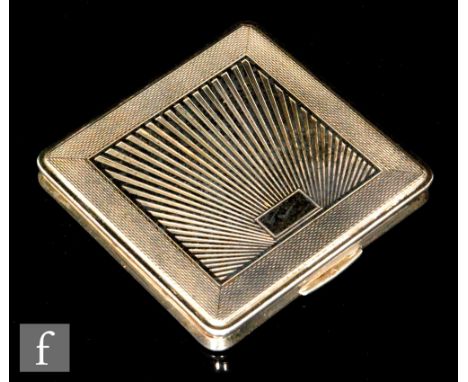 An Art Deco style hallmarked silver square compact with central sunburst decoration within engine turned borders, 7cm square,