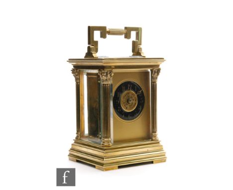 A 19th Century French brass carriage clock, blue enamelled circular Arabic dial in Corinthian column pillar, glazed case on s