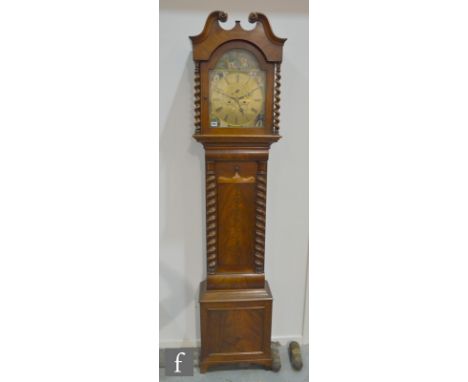 A 19th Century mahogany longcase clock with an eight-day movement, the case and hood with twin swan neck pediment and barley 