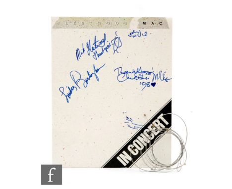A collection of Fleetwood Mac memorabilia to include a 1980 tour programme signed by Lindsey Buckingham, Christine McVie, Mic