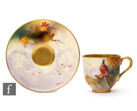 A Royal Worcester teacup and saucer decorated with a pheasant to a branch by R. Austin, diameter of saucer 9.5cm, puce mark w