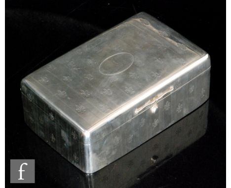 A hallmarked silver rectangular box detailed with fleur-de-lys within engine turned stripes, opening to purple velvet interio