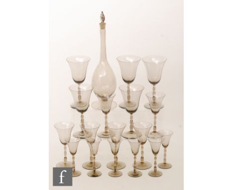 An early 20th Century Orrefors Sandvik Astrid decanter designed by Simon Gate circa 1918, of footed spherical form with a tal