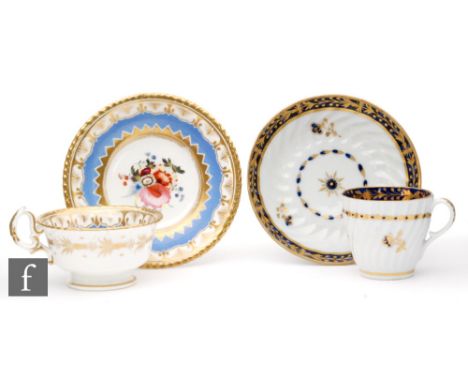 A Caughley teacup and saucer, circa 1840, of wrythen fluted form and decorated with a floral sprig in gilt and blue below a b