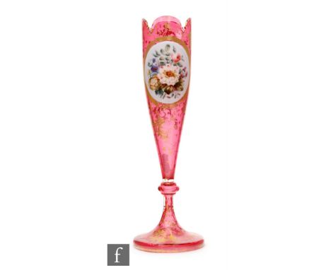 A 19th Century Bohemian tulip vase with circular spread foot rising to a knopped stem below a slender bowl with petal edged r