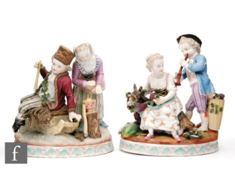 A pair of Dresden porcelain figural groups, the first of a woodcutter holding an axe and seated on a sleigh with a woman warm