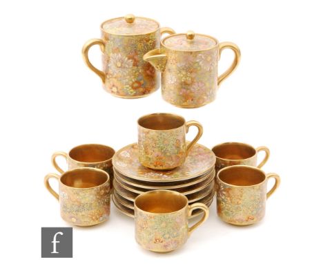 A Japanese Satsuma 'Hundred flower' design coffee/tea service comprising six saucers, six teacups, coffee pot, lidded milk ju