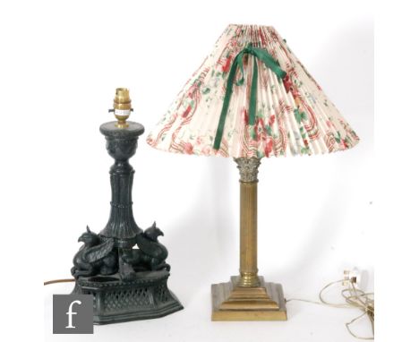 A brass Corinithian column table lamp, height 36cm, together with a spelter table lamp with two griffins below the central co