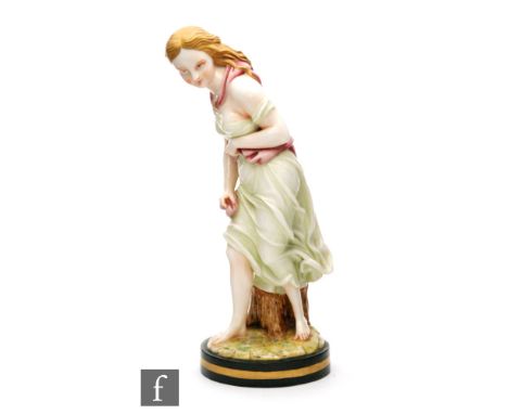 A 19th Century Royal Worcester figure by James Hadley modelled as a classical female in flowing green robes with a pink sash,