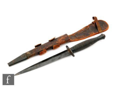 A Third Pattern Fairbarn-Sykes fighting knife, with a ribbed alloy grip, the pommel stamped with mould number 1, a 2 inch cro